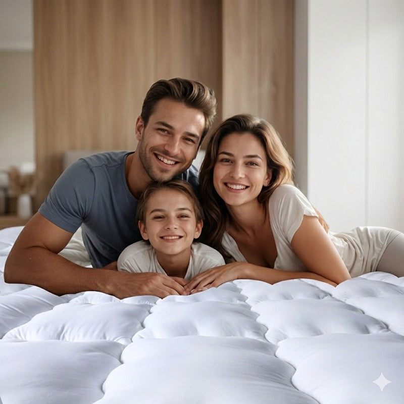 Family of three lying on a bed topper happily